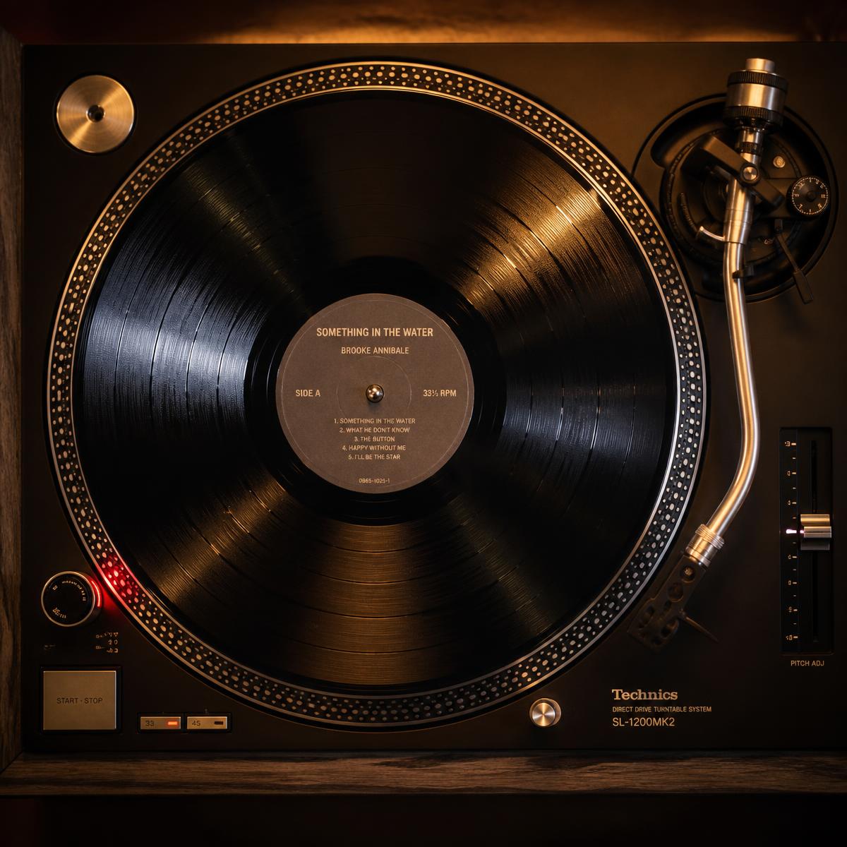 Vintage turntable with tonearm at rest